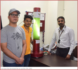 Students showcasing Algae-Based Air Purifier